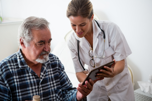 A medical professional reviewing information with a patient