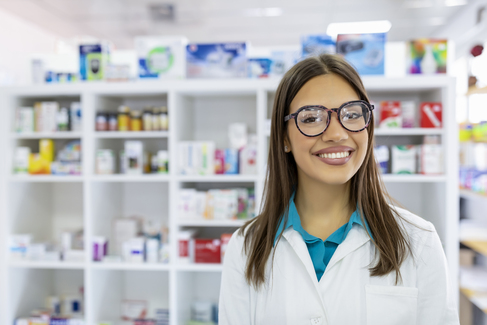 A smiling pharmacy technician