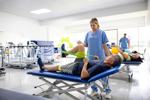 A physical therapy aide working with a client